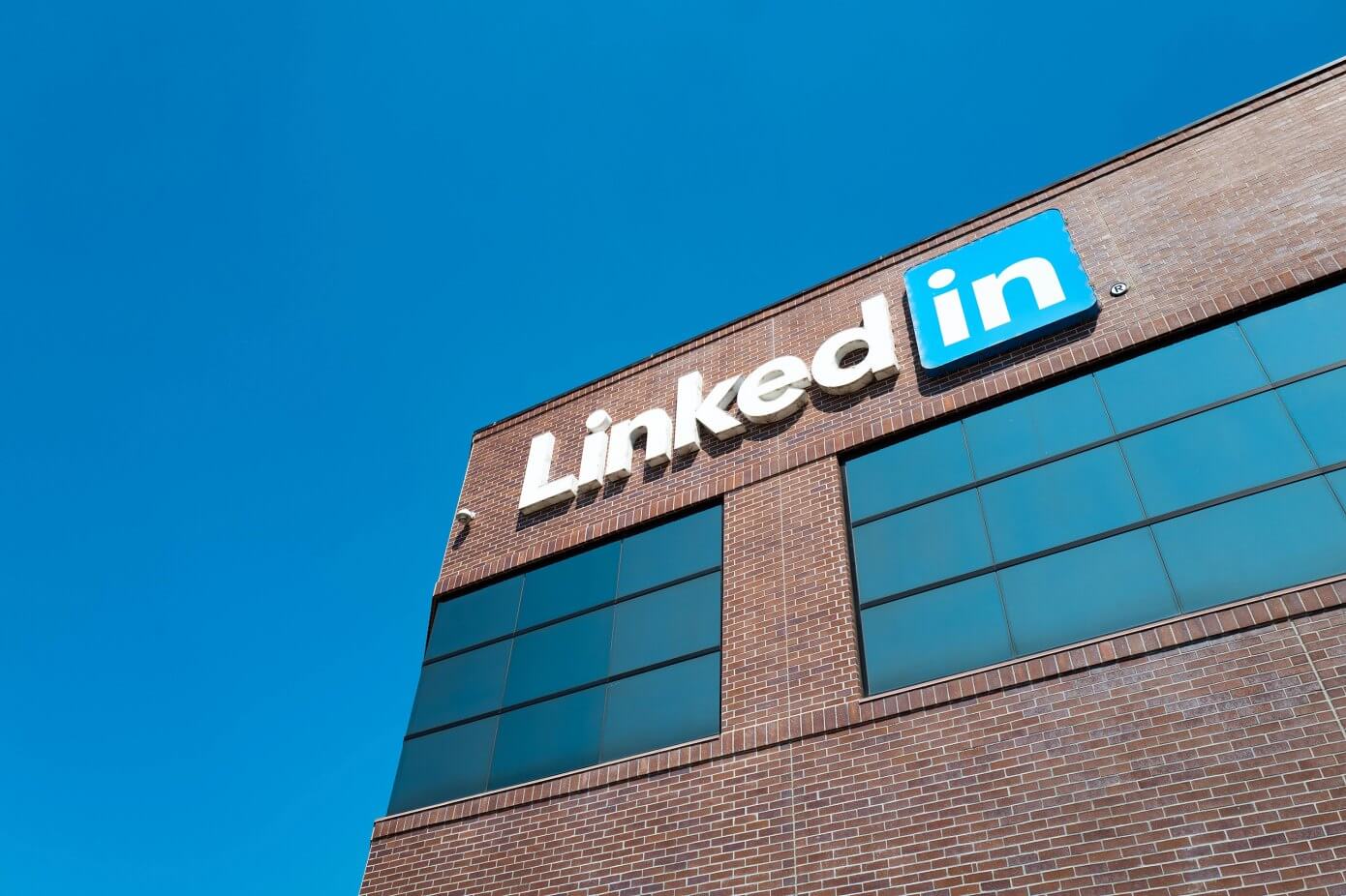 View of main building with logo and signage at the headquarters of professional social networking company LinkedIn, in the Silicon Valley town of Mountain View, California, August 24, 2016. (Photo by Smith Collection/Gado/Getty Images).